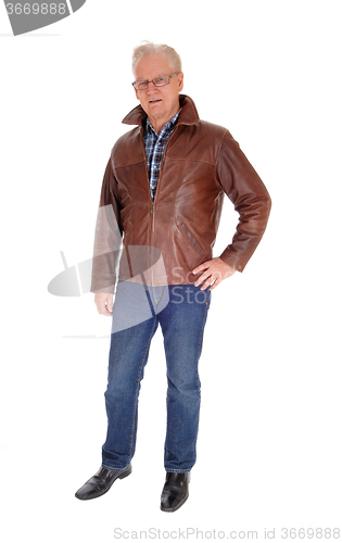 Image of Senior man in leather jacket standing.