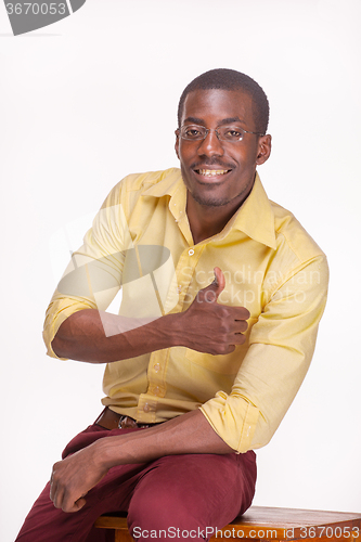 Image of portrait of handsome young black african smiling man