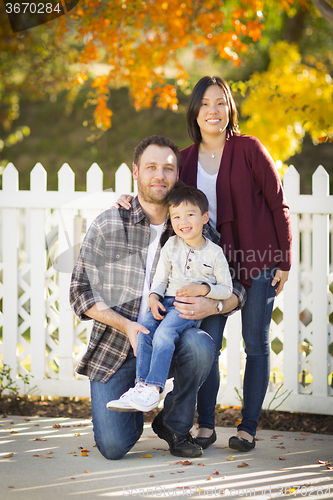 Image of Mixed Race Young Family Portrait Outdoors