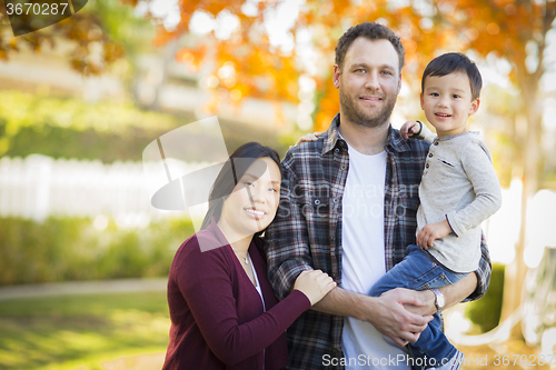 Image of Mixed Race Young Family Portrait Outdoors