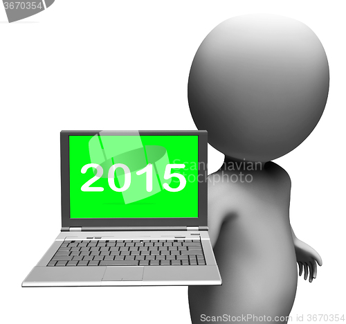 Image of Two Thousand And Fifteen Character And Laptop Shows New Year 201