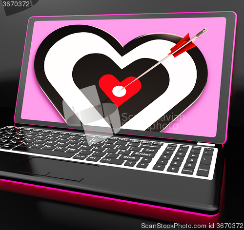 Image of Target Heart On Laptop Showing Passion