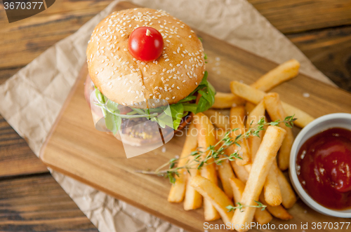 Image of Home made burgers on wooden background