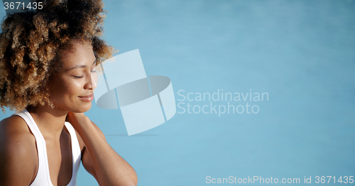 Image of Woman Taking Sunbath Near Swimming Pool