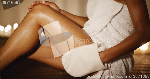 Image of Woman Massaging His Leg With Glove