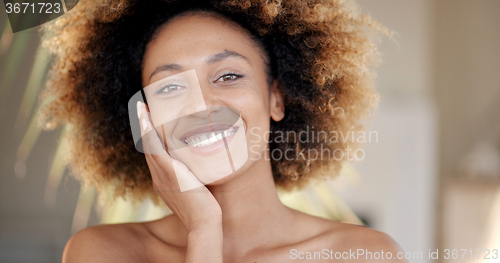 Image of Young Woman Against Palm Tree Branch