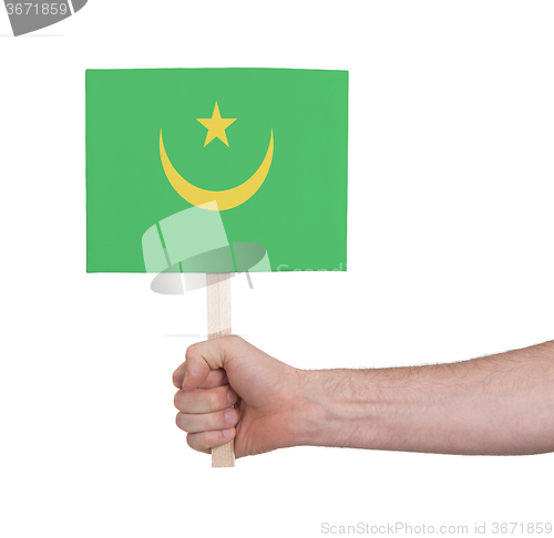 Image of Hand holding small card - Flag of Mauritania