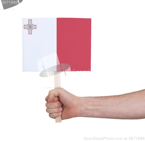 Image of Hand holding small card - Flag of Malta