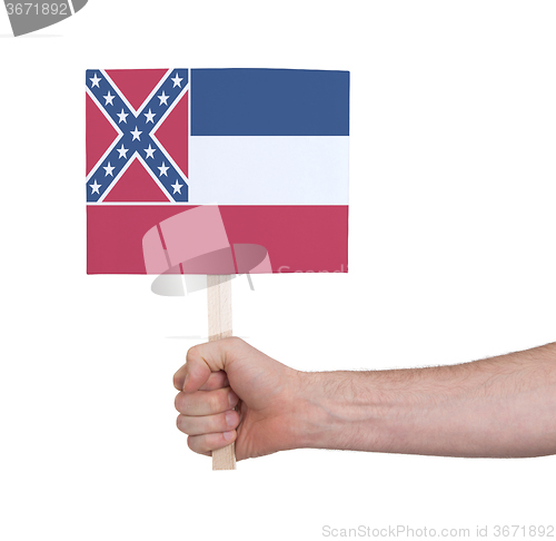 Image of Hand holding small card - Flag of Mississippi