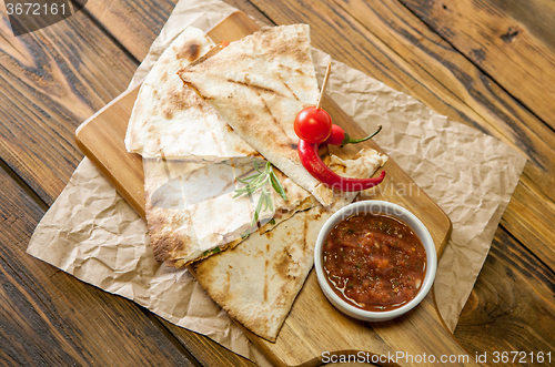 Image of Tacos on wooden background with sauce