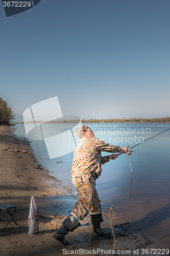 Image of Fisherman at the river