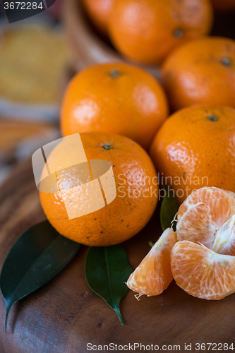 Image of tangerines on wooden background