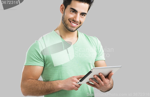 Image of Man working with a tablet, 