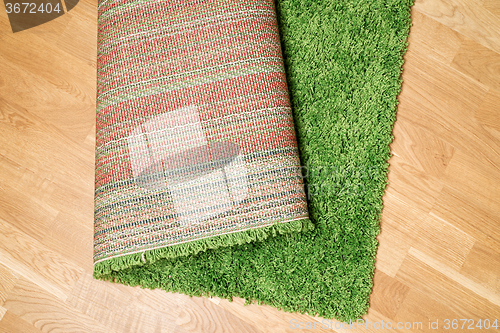 Image of rolled carpet on the floor