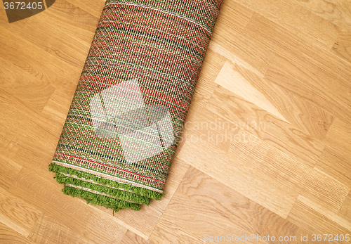 Image of rolled carpet on the floor