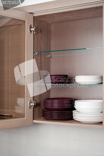 Image of mixed clean white and brown dishes 