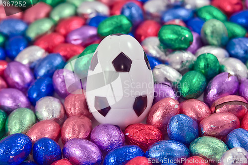 Image of soccer or football egg amongst other easter eggs