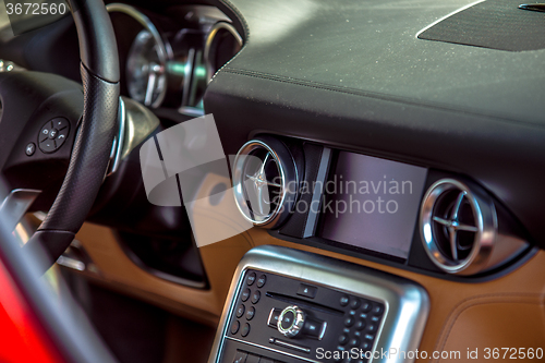 Image of luxury car interior dash steering wheel and controls