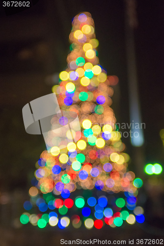 Image of defocused christmas tree lights in a city background