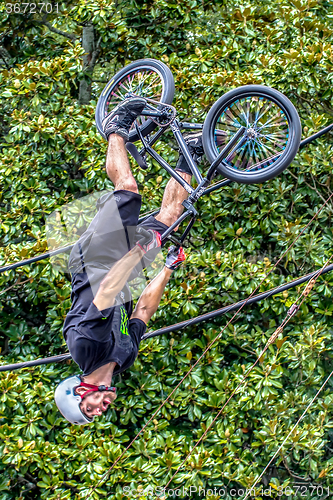 Image of bmx extreme team making stunt in downtown york south carolina at