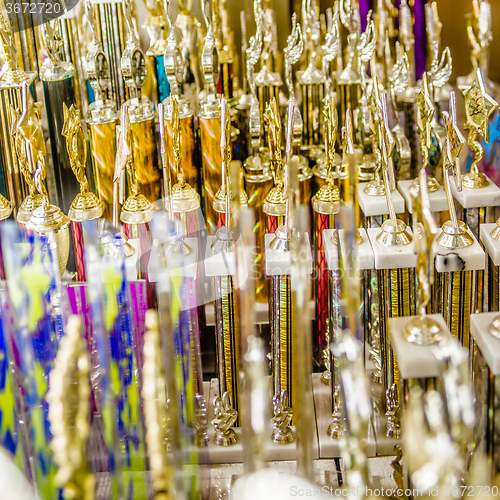 Image of champion trophies abstract on shelf display