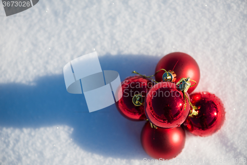 Image of red christmas ball in fresh snow