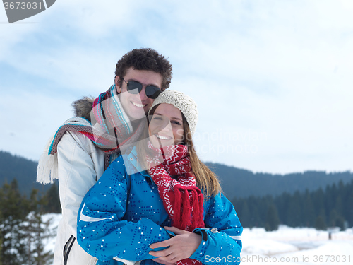 Image of romantic young couple on winter vacation