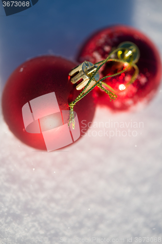 Image of red christmas ball in fresh snow