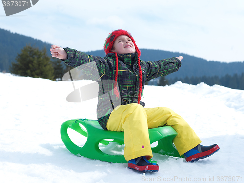 Image of happy young boy have fun on winter vacatioin on fresh snow