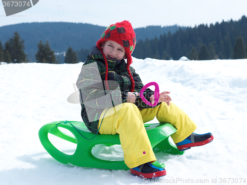 Image of happy young boy have fun on winter vacatioin on fresh snow