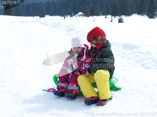 Image of portrait of boy and baby girl on winter vacation