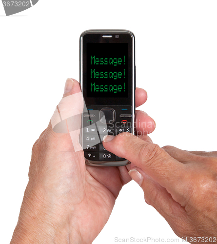 Image of Hands of senior woman with a mobile phone