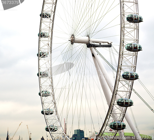 Image of london eye in the spring sky and white clouds