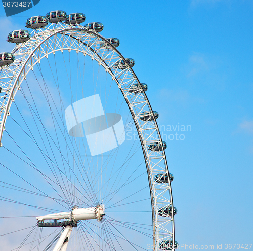 Image of london eye in the spring sky and white clouds