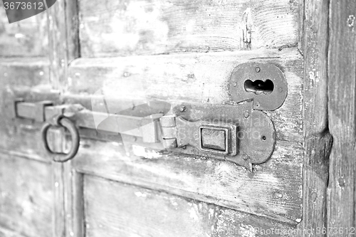 Image of europe old in  italy  antique close brown door and rusty lock  c