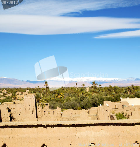 Image of brown  tower  old  construction in  africa morocco and  clouds  