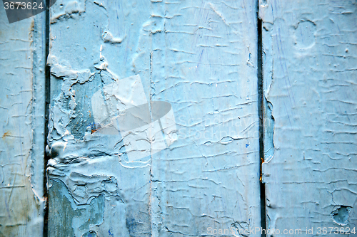 Image of dirty stripped paint in the blue wood  