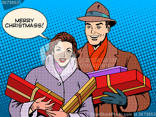 Image of Happy couple with Christmas gifts