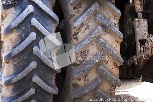 Image of wheel tractor  . dirty wheels