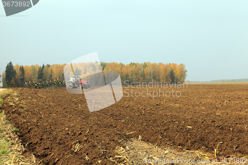 Image of plowed field  by a tractor 