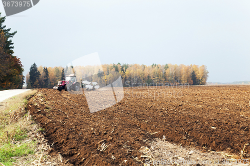 Image of plowed field  by a tractor 