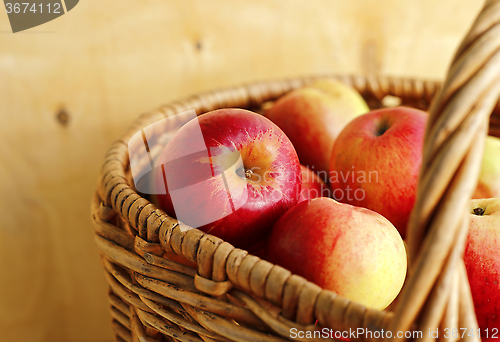 Image of Ripe bright apples in a basket 