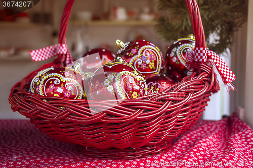 Image of Christmas decorations with balls in basket