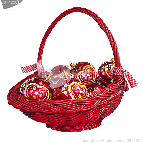 Image of Christmas decorations with balls in basket