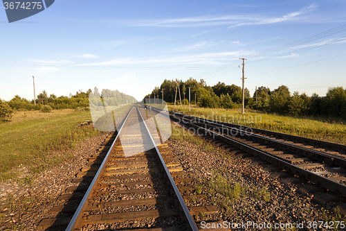 Image of   laying   small railway