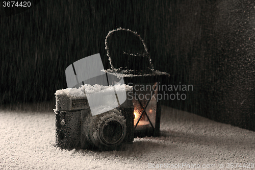 Image of Old camera in the snowing