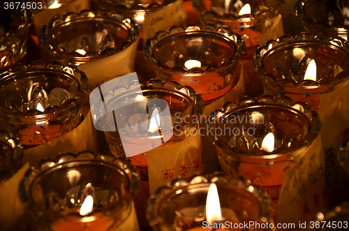 Image of Temple candles in transparent chandeliers