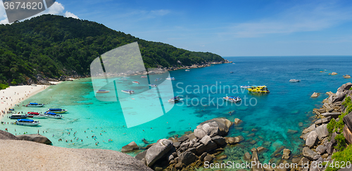 Image of Similan cove beautiful water with people and boats
