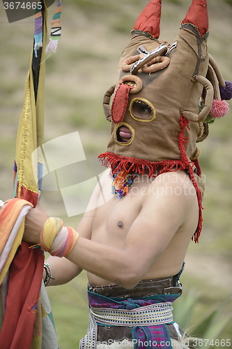 Image of Man in mask celebrating solstice holiday. 