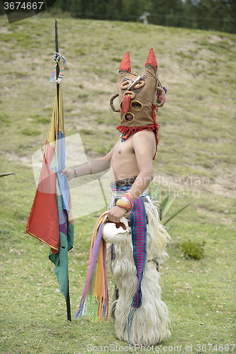 Image of Man in mask celebrating solstice holiday. 